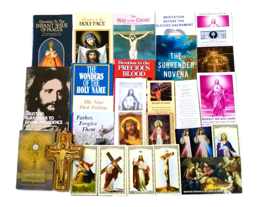 Collection of religious booklets and prayer cards with crucifix
