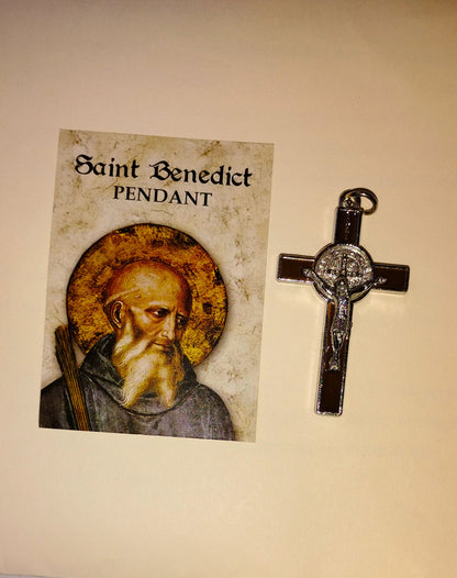Saint Benedict crucifix with a card featuring an illustration of Saint Benedict on a beige background