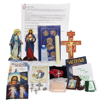 Picture of items in the Vital 3 Days of Darkness Kit. Click on the "Kit Items" Tab to see a list of all the items in this kit. This picture shows  Our Lady of Grace and Sacred Heart of Jesus with paperback RSV New Testament with Psalms.